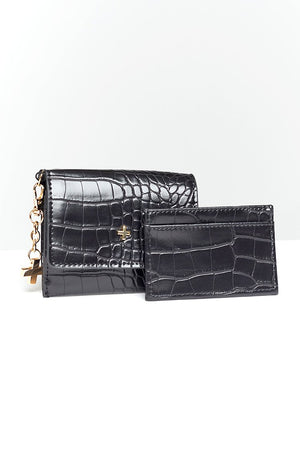 black patent leather card slot fold over wallet with gold hardware